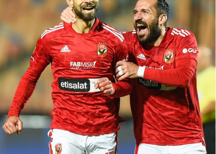 Al-Ahly’s midfielder Amr el-Sulaya (L) celebrates with Tunisian left-back Ali Maaloul after scoring against Pyramids FC.