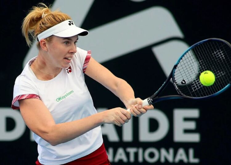 Czech Linda Noskova makes a backhand return to Russia's Daria Kasatkina during their Round of 32 match at the Adelaide International Tennis tournament in Adelaide, Australia, Monday, Jan. 2, 2023.