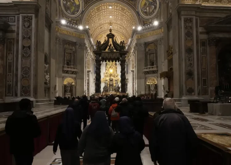 Mourners enter St. Peter's Basilica where the body of Pope Emeritus Benedict XVI lies in state inside at The Vatican, Wednesday, January 4, 2023.