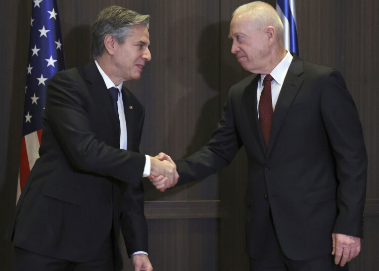 U.S. Secretary of State Antony Blinken, left, shakes hands with Israeli Defense Minister Yoav Gallant in Jerusalem Tuesday, Jan. 31, 2023. (Ronaldo Schemidt/Pool Photo via AP)
