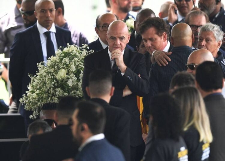 Infantino: FIFA to ask all countries to name a stadium for Pele 1 - Egyptian Gazette FIFA President Gianni Infantino (C) attends the wake of Brazilian football legend Pele at the Urbano Caldeira stadium in Santos, Sao Paulo, Brazil on January 2, 2023.