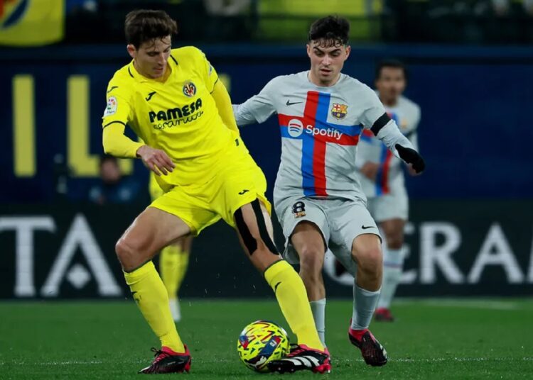 Barcelona midfielder Pedri (R) fired his team to victory against Villarreal.