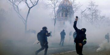 French labour minister says raising pensions age is ‘non-negotiable’ despite mass protests