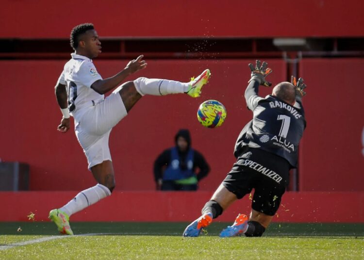 Real loses ahead of CWC tie against Al-Ahly 1 - Egyptian Gazette Real Madrid's Vinicius Junior (L) in action against Mallorca's goalkeeper Predrag Rajkovic during their Spanish La Liga match in Palma de Mallorca, Spain.