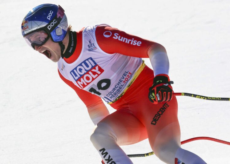 Switzerland's Marco Odermatt celebrates after completing the alpine ski, men's World Championship downhill, in Courchevel.