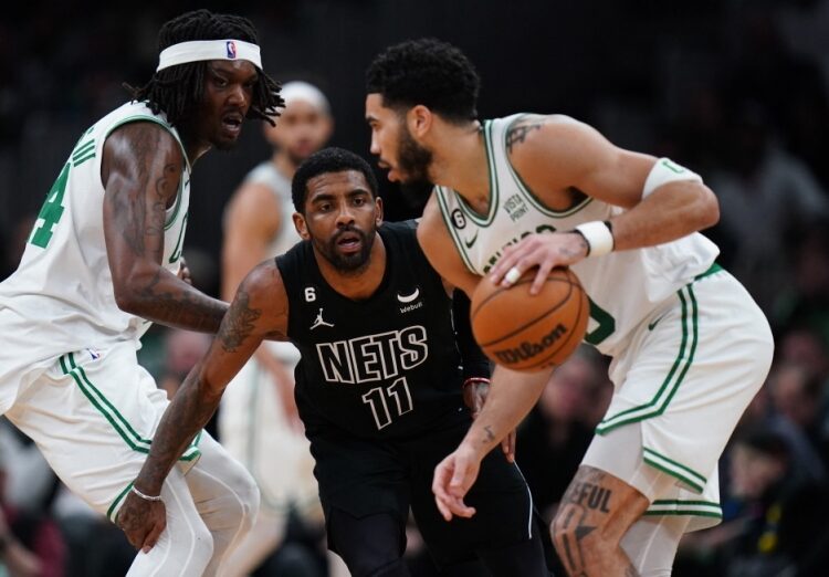 Irving asks Nets for trade, says report 1 - Egyptian Gazette Brooklyn Nets guard Kyrie Irving (11) defends against Boston Celtics forward Jayson Tatum (0) and centre Robert Williams III (44) in the second half at TD Garden.