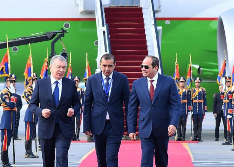President Abdel Fattah El Sisi welcoming Uzbek President Shavkat Mirziyoyev upon arrival at Cairo International Airport on Monday.