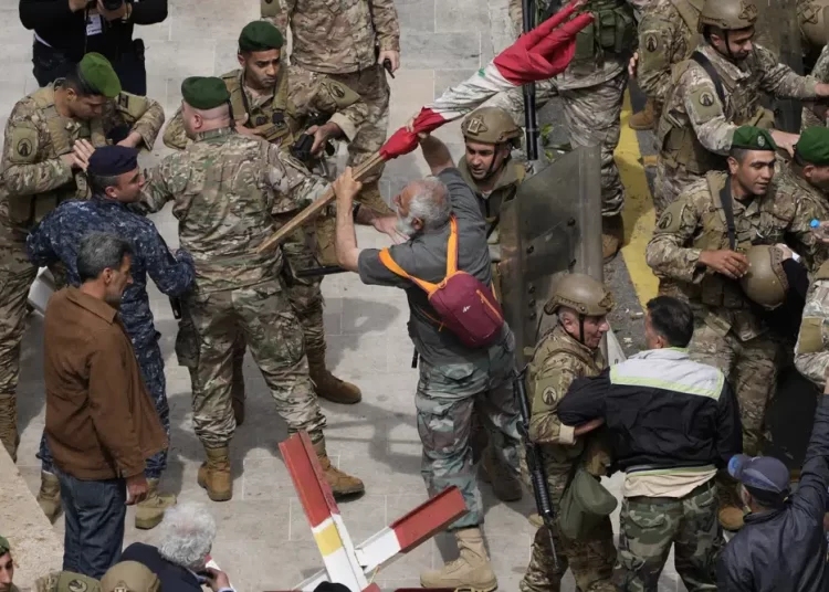 Retired soldiers, policemen try to storm government headquarters in Lebanon 1 - Egyptian Gazette