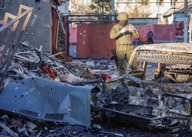 An investigator works in the site of a recent shelling in the course of Russia-Ukraine conflict, in the town of Volnovakha in the Donetsk region, Russian-controlled Ukraine, March 13, 2023. REUTERS/Alexander Ermochenko