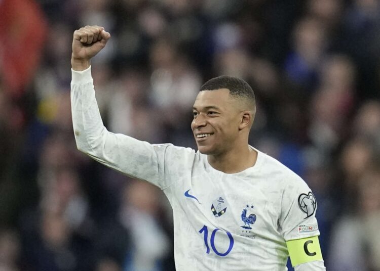 France's Kylian Mbappe celebrates after scoring his side's third goal during the Euro 2024 group B qualifying match between France and the Netherlands.