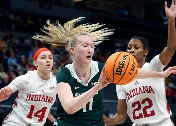 Holmes scores 27, Indiana holds off Michigan 94-85 1 - Egyptian Gazette Michigan State guard Matilda Ekh, of Sweden (C) is defended by Indiana guards Sara Scalia (14) and Chloe Moore-McNeil (22) during an NCAA college basketball game in Minneapolis.