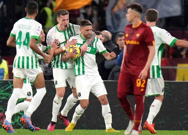 Sassuolo's players celebrate after scoring against AS Roma during a Serie A match.