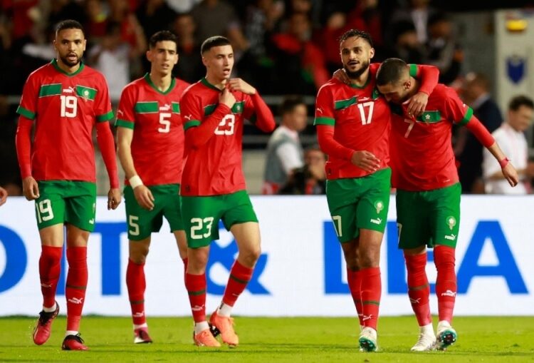 Morocco’s players celebrate scoring in the international friendly match against Brazil at the Grand Stade de Tanger in Tangier, Morocco.