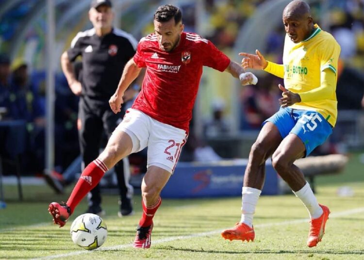 Al-Ahly’s player Ali Maaloul (L) vies for the ball against Mamelodi Sundowns defender.