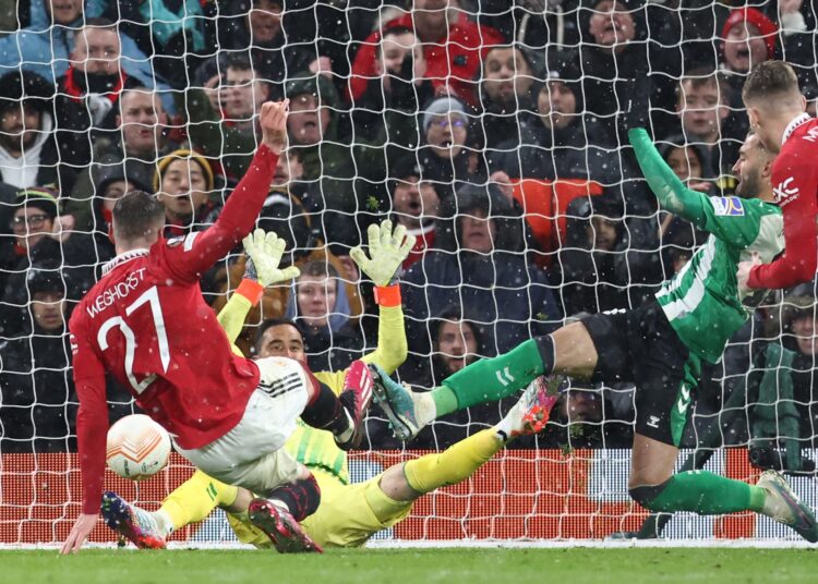 Manchester United's striker Wout Weghorst scores their fourth goal during the UEFA Europa league round of 16 first-leg match against Real Betis in Manchester.