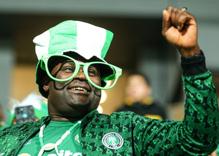 A Nigerian supporter cheers during the quarter-finals match between Nigeria and Uganda at the Ismailia Stadium.