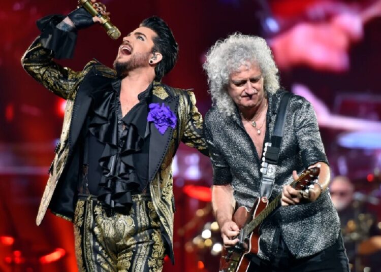 Queen and Lambert eager for post-pandemic tour 1 - Egyptian Gazette A file photo shows Adam Lambert (L) and Brian May of Queen perform in Chicago on Aug. 9, 2019.