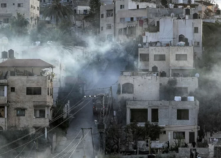 Egypt decries Israeli forces’ raid on Jenin 1 - Egyptian Gazette Israeli army vehicles move along a road during a raid in the Jenin camp for Palestinian refugees in the occupied West Bank.