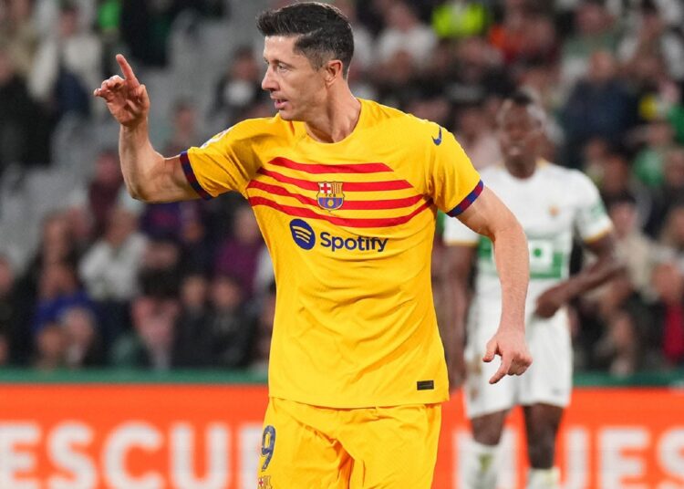 Barcelona's Robert Lewandowski reacts during a Spanish La Liga match against Elche in Elche.