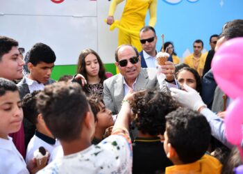 President hands out gifts to children during Eid Al- Fitr celebration