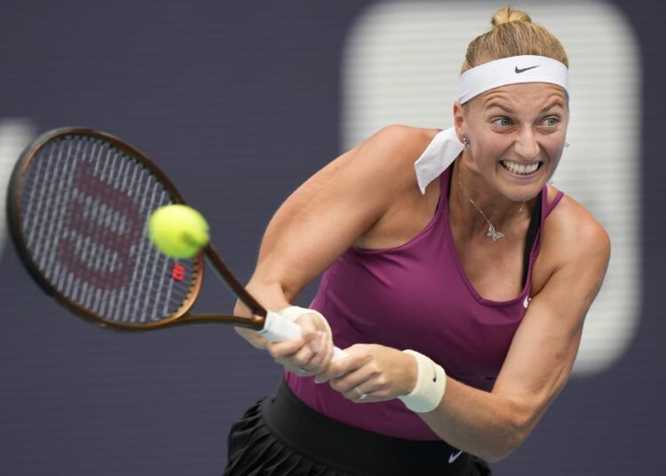 Petra Kvitova returns a shot from Elena Rybakina during the women's singles finals of the Miami Open tennis tournament.