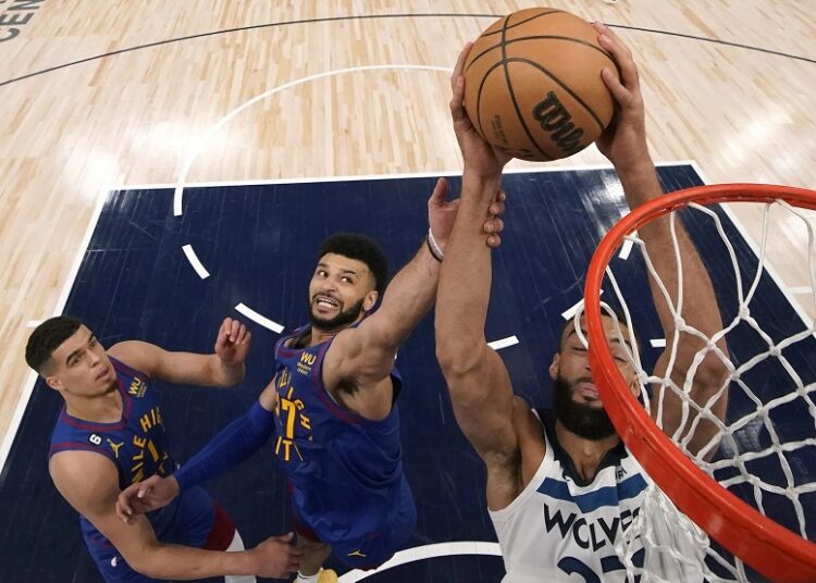 Phoenix Suns rout Los Angeles Clippers 112-100 1 - Egyptian Gazette Minnesota Timberwolves center Rudy Gobert shoots while defended by Denver Nuggets Michael Porter (L) and guard Jamal Murray during Game 3 of an NBA basketball first-round playoff series in Minneapolis.