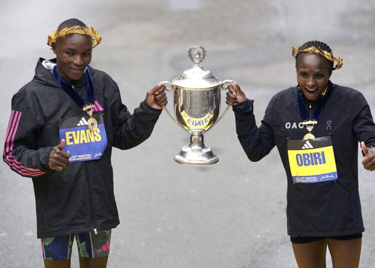 Boston Marathon sweep for Kenya 1 - Egyptian Gazette Evans Chebet and Hellen Obiri, both of Kenya, hold the trophy at the finish line after winning the 127th Boston Marathon.