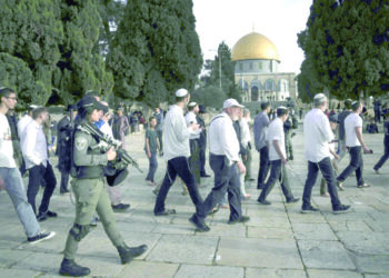 Palestinian teen killed in army raid as settlers hold march
