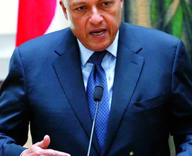 Egyptian foreign minister Sameh Shoukry, speaks to the media after a meeting with Cyprus' foreign minister Ioannis Kasoulides and Greek foreign minister Evangelos Venizelos at the foreign ministry in capital Nicosia, Cyprus, Wednesday, Oct. 29, 2014. Venizelos, Kasoulides and Shoukry, told reporters after meeting with President  Anastasiades that Greece will be making its presence more felt in the seas off Cyprus but that it was due to its NATO and U.N. obligations and not because of Turkeyís recent activities in the area. (AP Photo/Petros Karadjias)