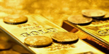 Gold holds near one-year highs as Fed seen pausing rates