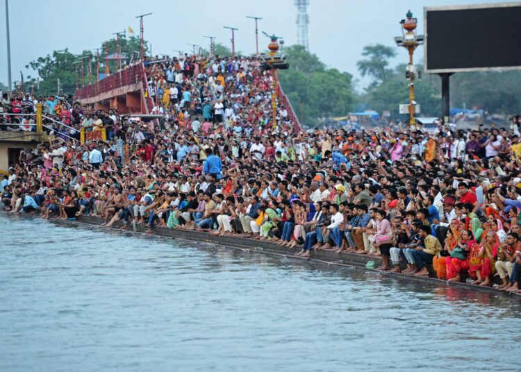 India to pass China this week as world's most populous nation, says UN 1 - Egyptian Gazette Devotees gather to attend the evening prayers at Har Ki Pauri on the banks of river Ganges in Haridwar, in India's Uttarakhand state on April 23, 2023. - India is set to overtake China as the world's most populous country by the end of June, UN estimates showed on April 19, posing huge challenges to a nation with creaking infrastructure and insufficient jobs for millions of young people. (Photo by SHAMMI MEHRA / AFP)