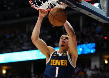 Jokic leads Nuggets past Suns 97-87