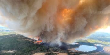 Out-of-control wildfires in western Canada forces 25,000 people to flee homes