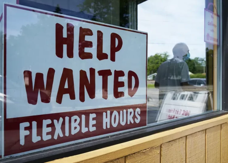 A help wanted sign is displayed in Deerfield, Ill., on Wednesday, September 21, 2022.