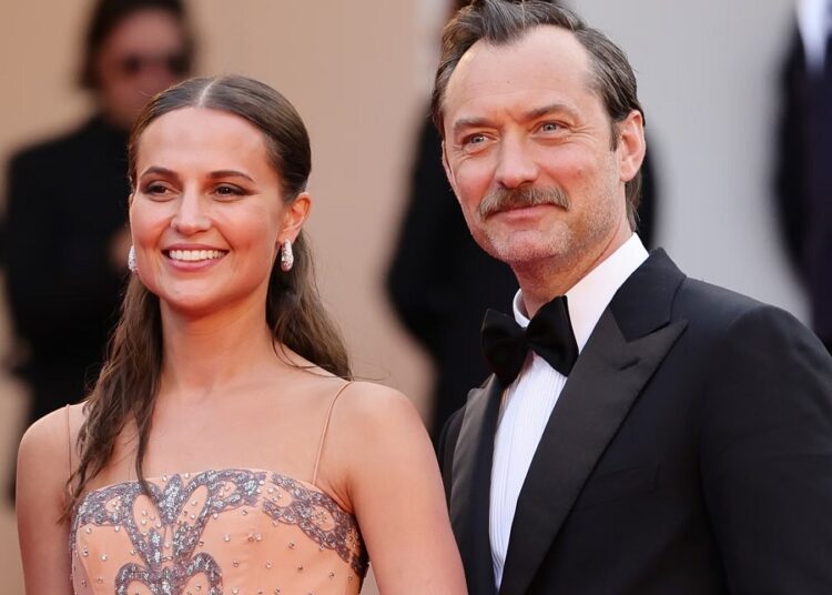 Alicia Vikander and Jude Law attend the "Firebrand (Le Jeu De La Reine)" red carpet during the 76th annual Cannes film festival at Palais des Festivals on May 21, 2023 in Cannes, France.
