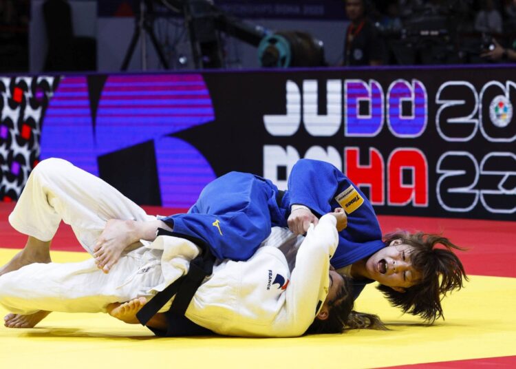 Tsunoda snatches 3rd world judo title 1 - Egyptian Gazette Natsumi Tsunoda (in blue) and France's Shirine Boukli compete in the women's 48-kilogramme final at the world judo championships in Doha.