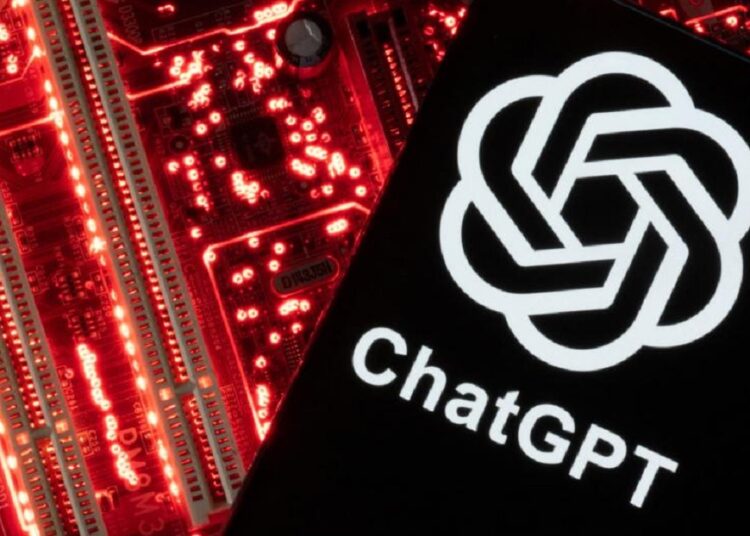 A smartphone with a displayed ChatGPT logo is placed on a computer motherboard in this illustration taken February 23, 2023.