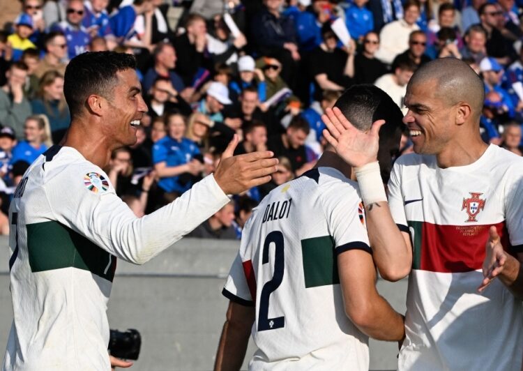Portugal's Cristiano Ronaldo celebrates with teammate Pepe after scoring a goal against Iceland in Reykjavik June 21.