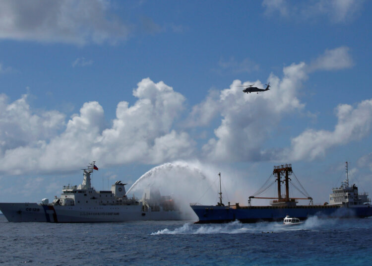 Taiwan’s armed forces hold coastal drills 1 - Egyptian Gazette A Taiwan Coast Guard ship (L) extinguishes a fire on a cargo ship during a rescue drill near the coast of Itu Aba, which the Taiwanese call Taiping, at the South China Sea, November 29, 2016. REUTERS/J.R Wu