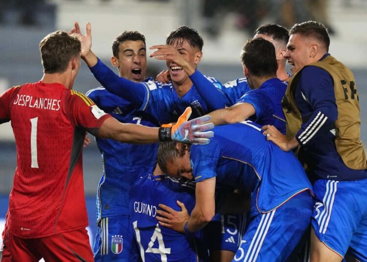 Italy’s players celebrate their team's win over South Korea at the end of a FIFA U-20 World Cup semi-final match.