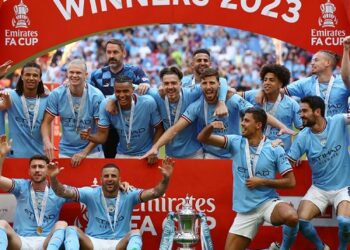 Guardiola urges players to seize treble chance