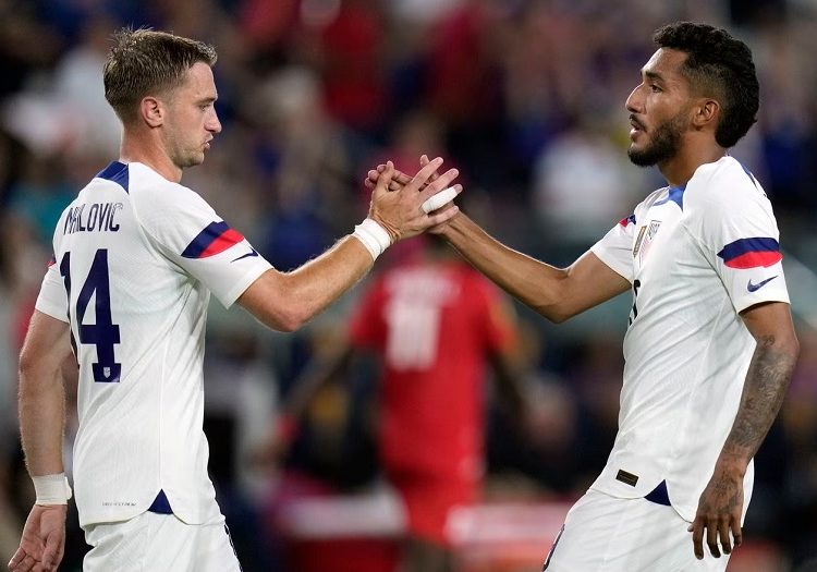 United States' Jesus Ferreira (R) is congratulated by teammate Djordje Mihailovic after scoring during the second half of a CONCACAF Gold Cup soccer match against St. Kitts & Nevis.