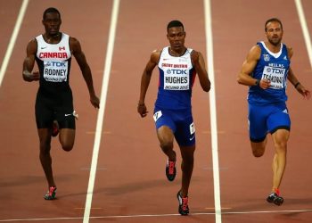 Hughes targets world glory after regaining 100m title