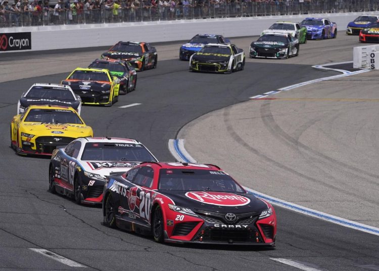 Martin Truex Jr. leads the pack during the NASCAR Cup Series race in Loudon, New Hampshire.