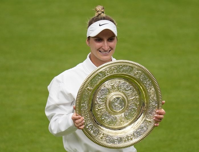 Marketa is Wimbledon's 1st unseeded female champion 1 - Egyptian Gazette Marketa Vondrousova celebrates with the trophy after winning the Wimbledon championships.