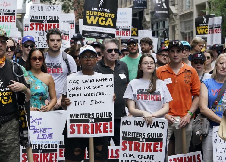 Members of the Writers Guild of America and the Screen Actors Guild walked a picket line together just before the actors' strike takes effect.