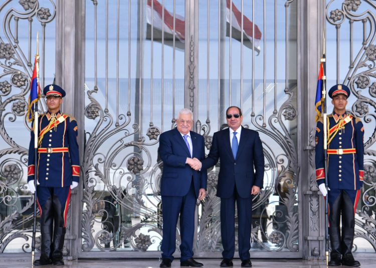 President Abdel Fattah El Sisi shaking hands with Palestinian President Mahmoud Abbas at the start of their meeting on Monday.