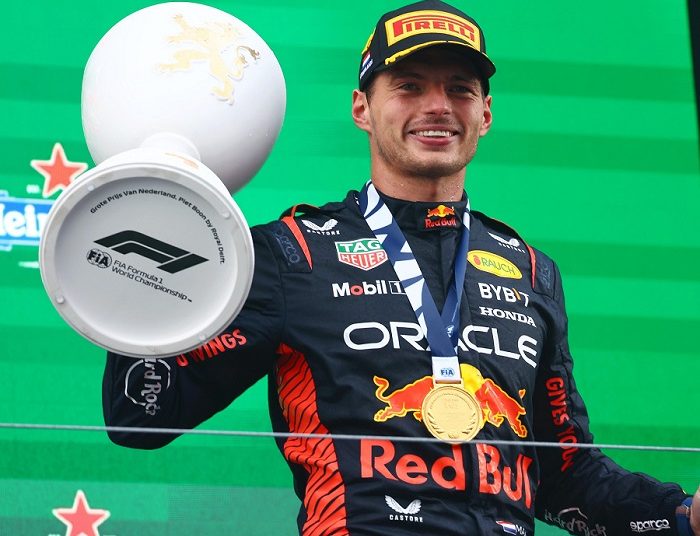 Verstappen takes record-equalling 9th win in a row 1 - Egyptian Gazette Max Verstappen celebrates with the trophy on the podium after winning the Dutch Formula One Grand Prix.