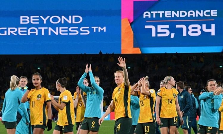 Australia players celebrate after winning the Women's World Cup quarter-final soccer match against France in Brisbane.