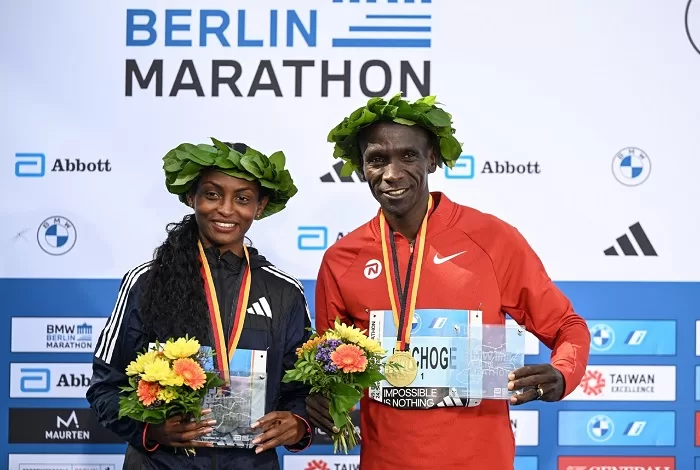 Assefa smashes marathon world record 1 - Egyptian Gazette Tigist Assefa (L) and Eliud Kipchoge laughing together after the Berlin race.